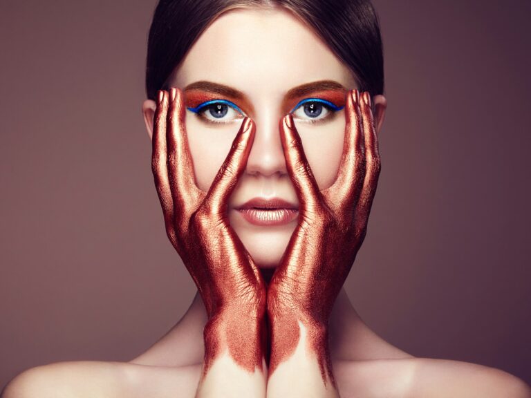 Portrait of beautiful young woman with art make-up