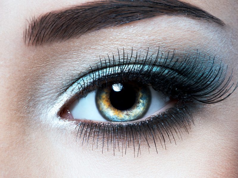 Woman's eye with blue eye makeup